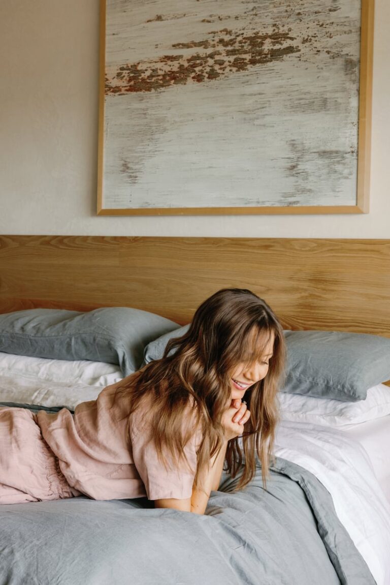 woman in pjs on bed