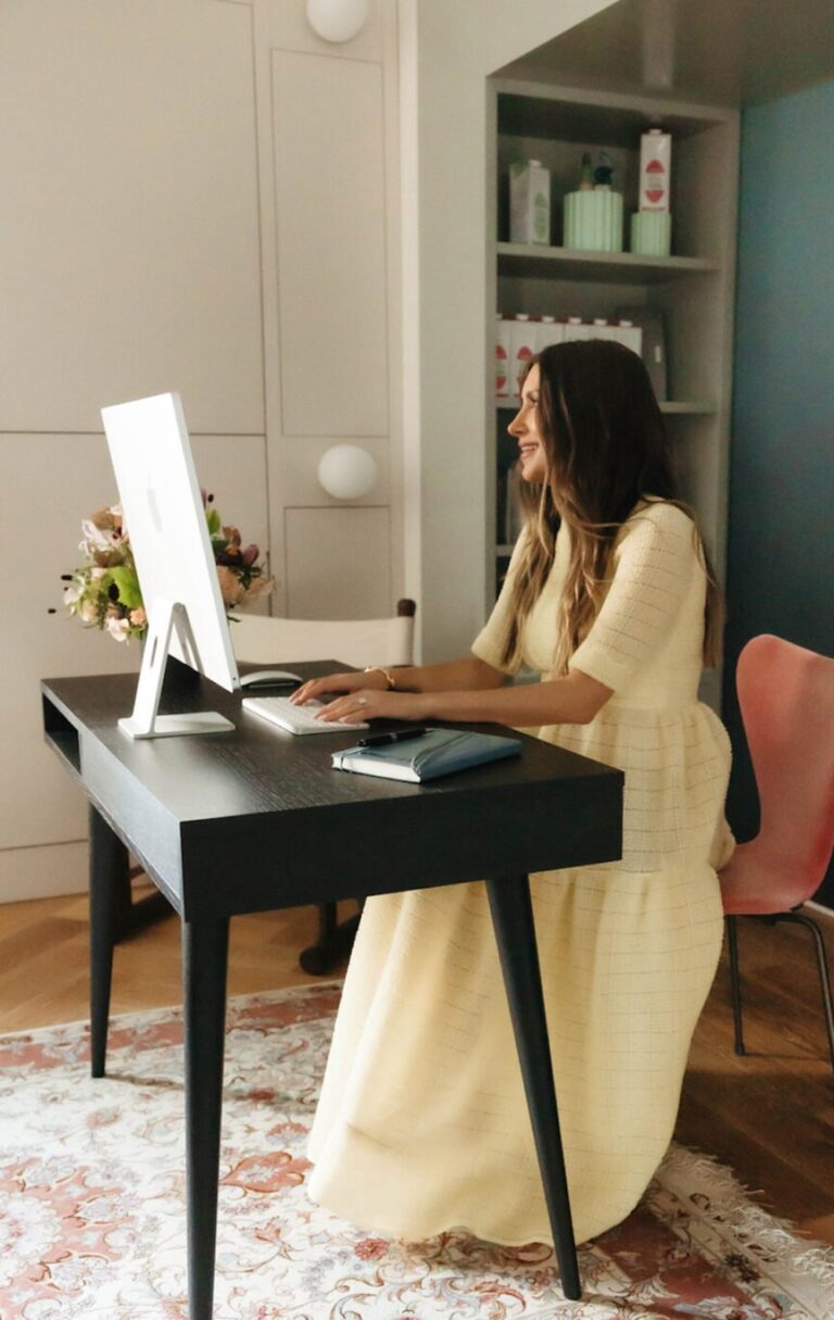 woman typing on computer 865x1368