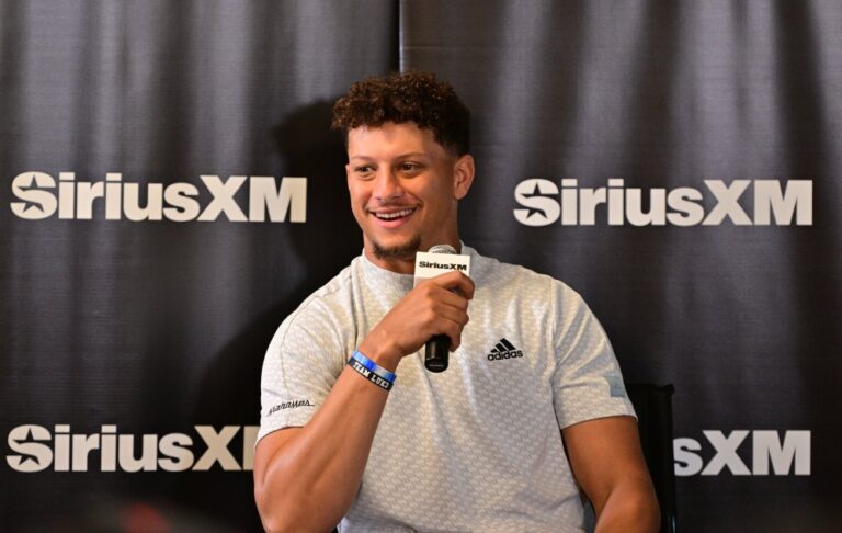 Patrick Mahomes signs football for kids 2166665193