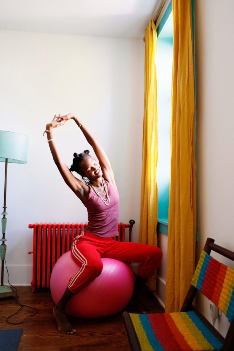 woman stretching on yoga ball 865x1298