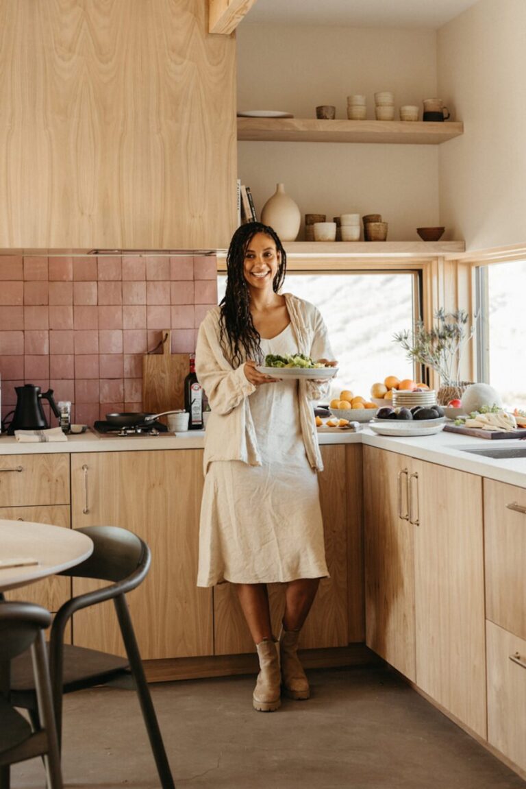 woman holding food in kitchen 865x1296