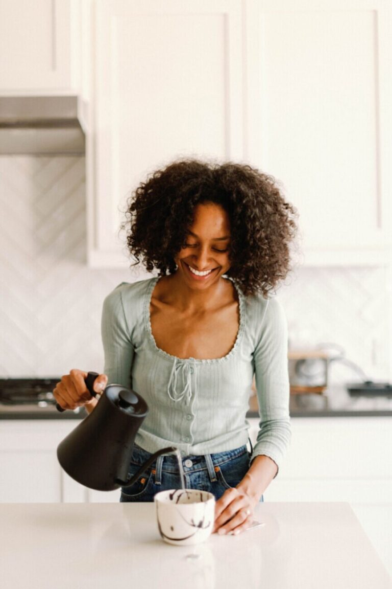 woman brewing tea 865x1298