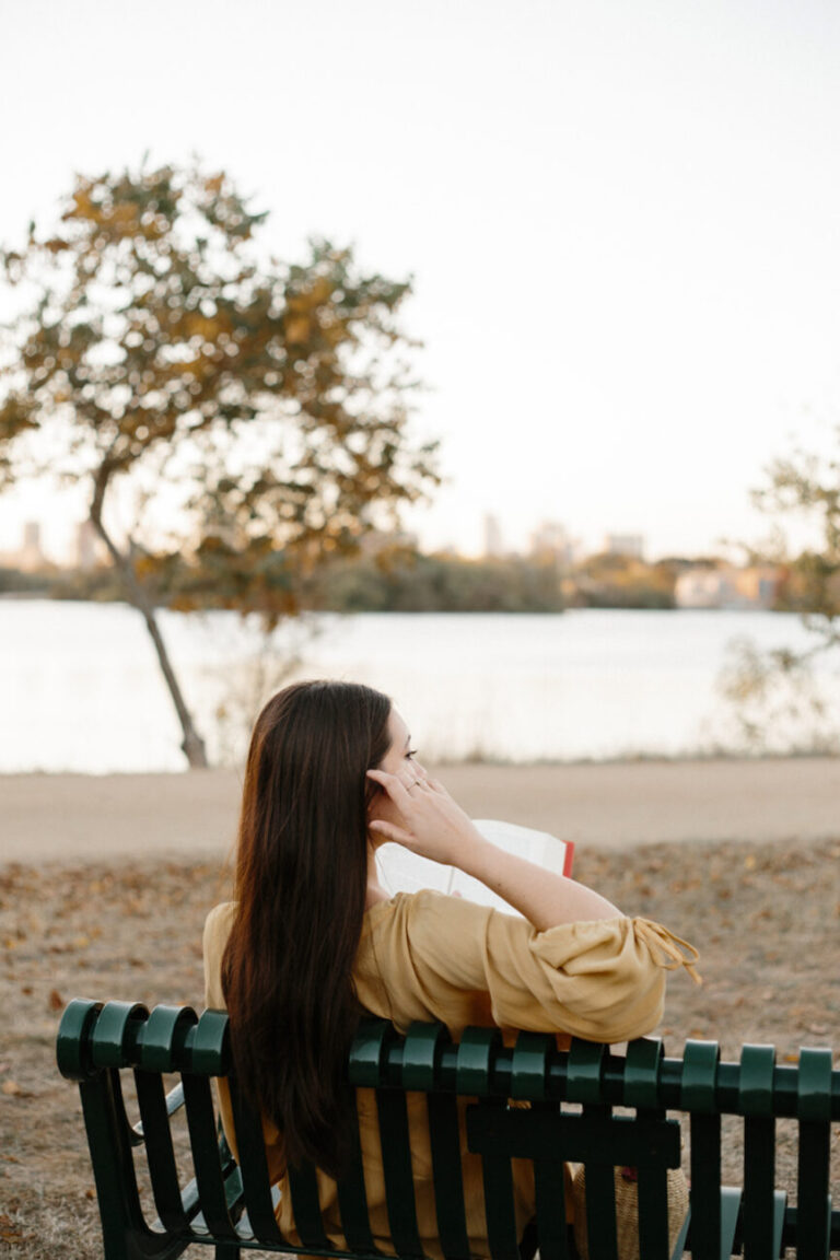 woman reading book outside 865x1298