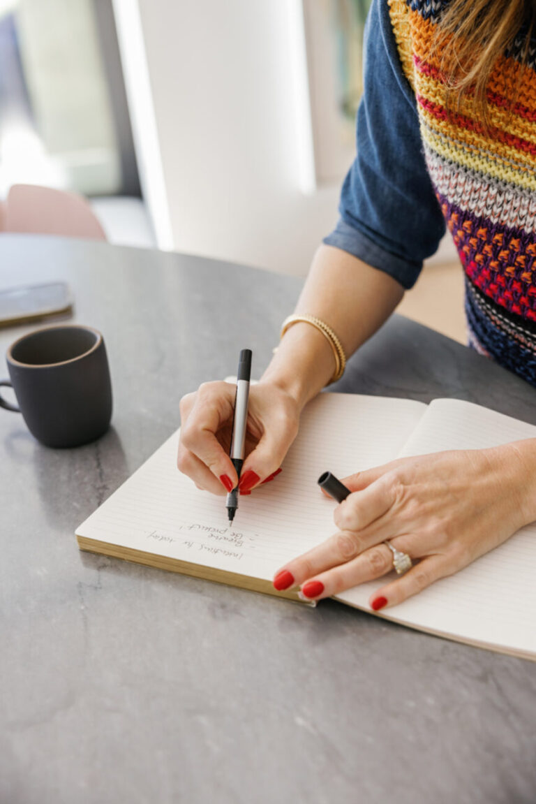 woman writing in journal 865x1296