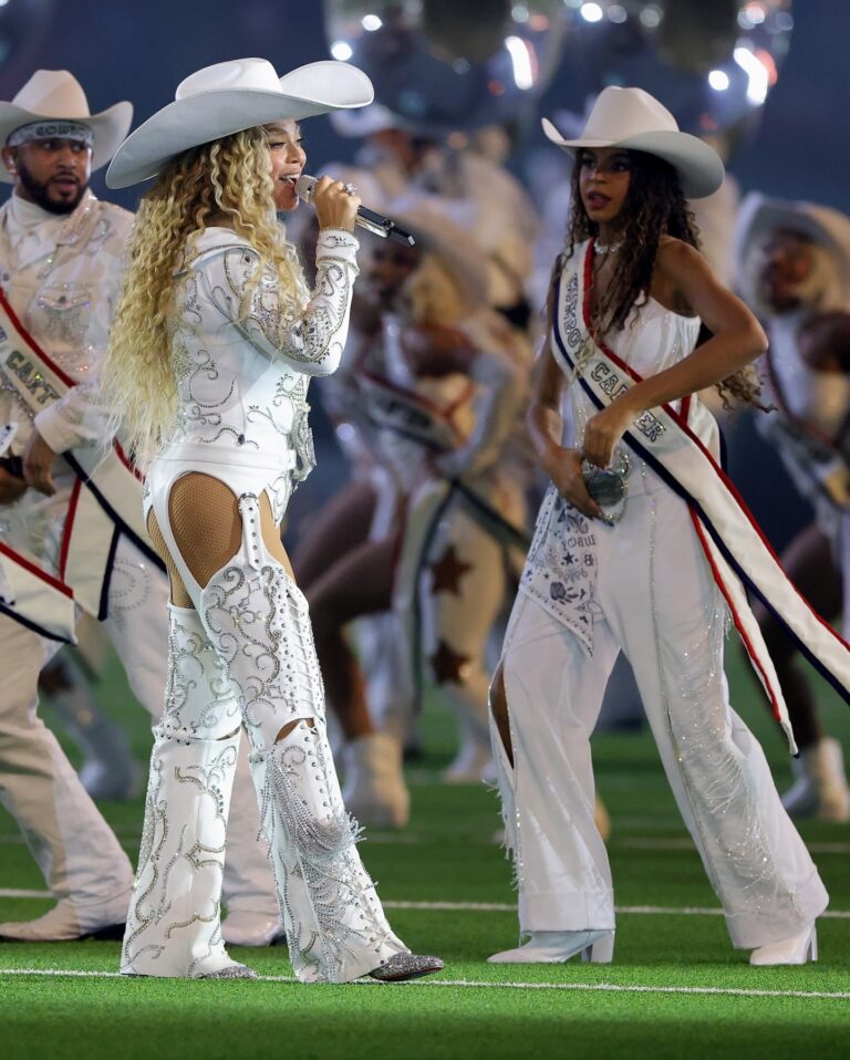 Beyonce Wears Custom Roberto Cavalli Couture White Feather Look and an ASN Cowboy Hat while Blue Ivy Wears Custom Frolov Heart and a Stetson Hat to Perform for NFL Halftime on Christmas Day