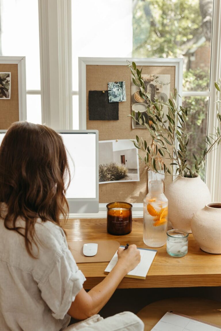 woman writing at computer 865x1296